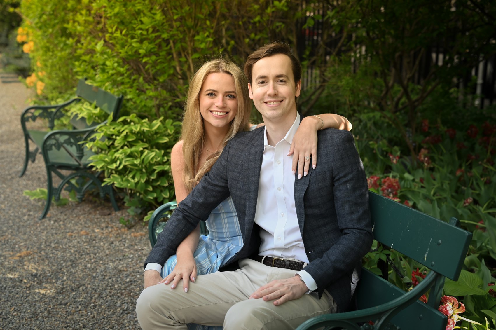 Kaitlin and Nick close together on the bench, his arm around her